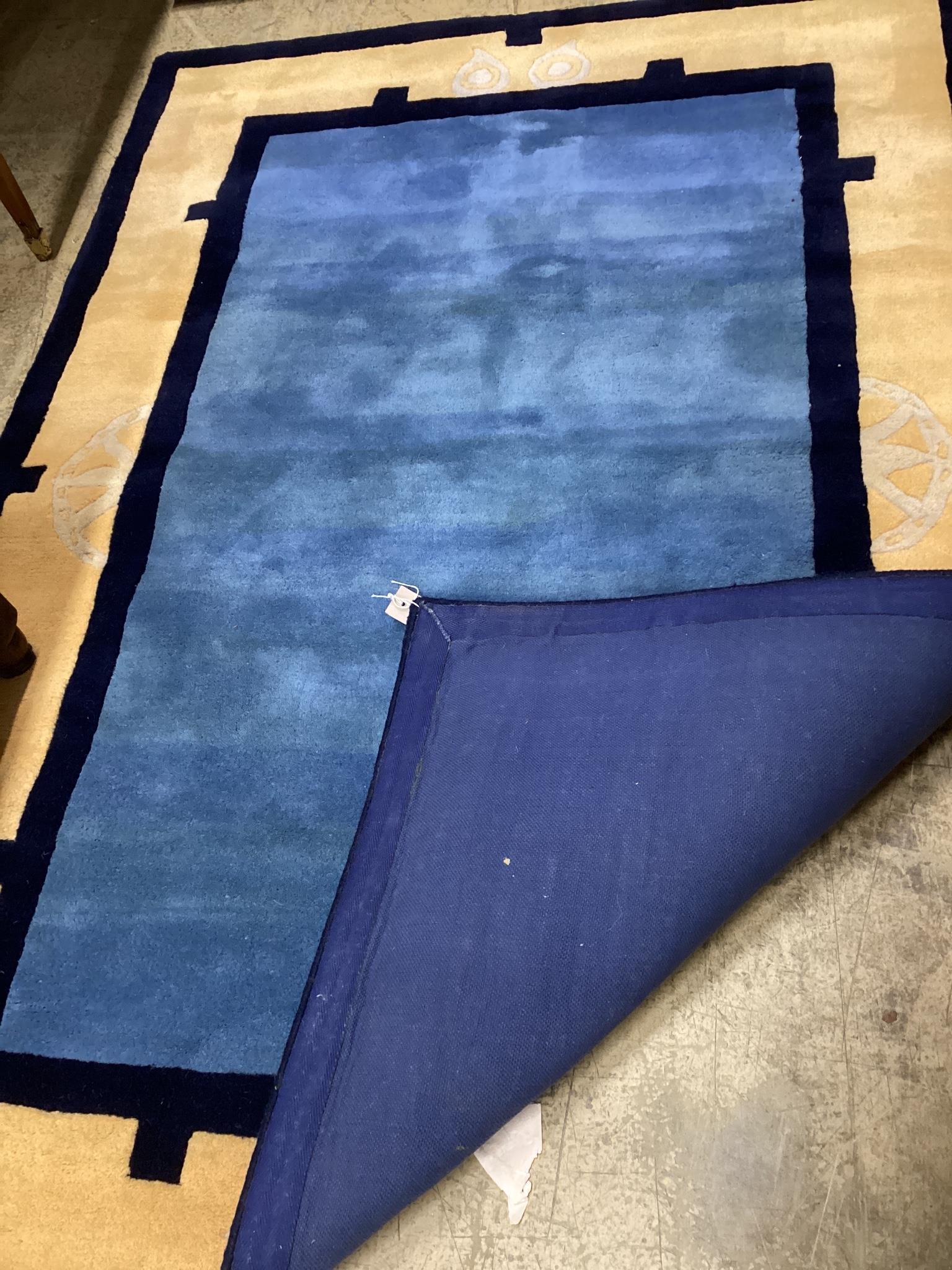 A contemporary Chinese style blue ground rug, 180 x 124cm